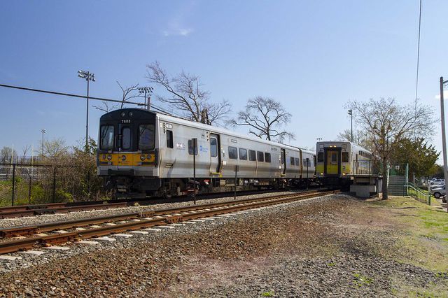 Two Long Island Rail Road trains powered by batteries on the train tracks on Long Island.